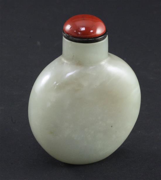 A Chinese pale celadon and russet jade snuff bottle, 6.5cm